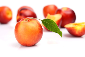Several sliced nectarines isolated on white