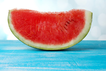 Fresh slice of watermelon on blue background