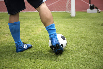 soccer player running before shooting