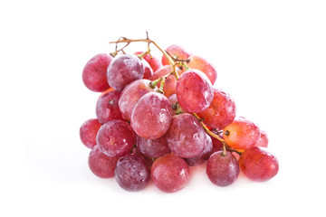 Fresh red grapes isolated on white background