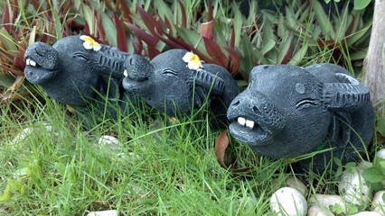 cute buffalo statue in garden