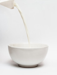 Pouring milk into a bowl