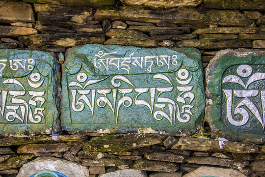 mani stones on mani wall
