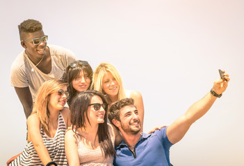 Group of multiracial happy best friends taking selfie