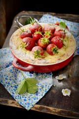 Cheesecake with strawberries in a bowl