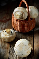 Whole button mushrooms in a basket