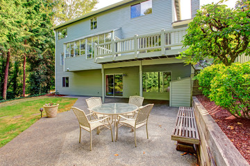 House exterior. Backyard with patio area