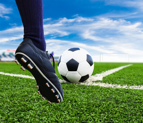 foot kicking soccer ball