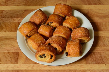 Sweet rolls with raisins on a plate