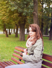 woman sitting bench outside