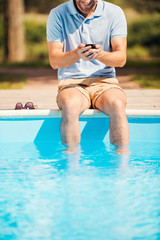 Man relaxing poolside.