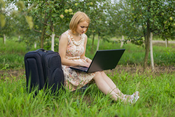 girl with laptop on the nature