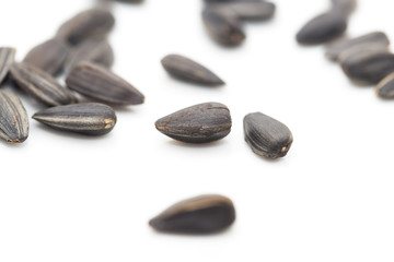 black seeds on a white background