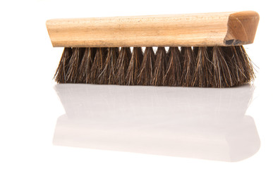 Wooden shoe shine polish brush over white background 