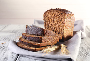 Fresh bread on wooden table, close up