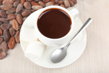 Cup of hot chocolate on table, close up