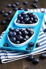 Delicious blueberries on table close-up