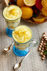 Tasty lemon desserts on table at home