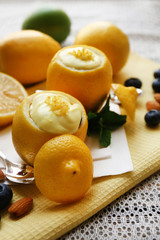Tasty lemon desserts on table at home