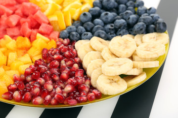 Sliced fruits on plate on table