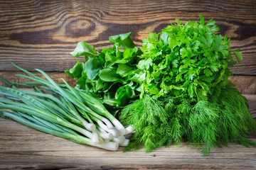 Fresh herbs on  wooden background © istetiana