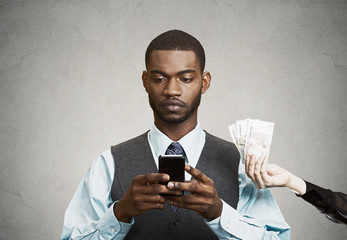 Busines man using smart phone, while offered financial reward