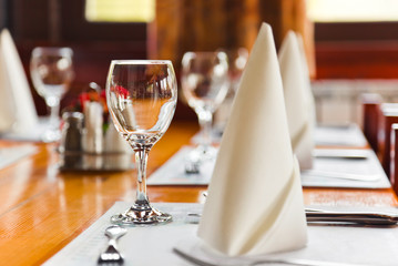 Glasses and plates on table in restaurant