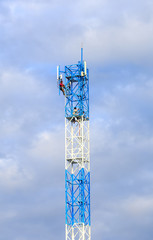 Worker working on communication tower