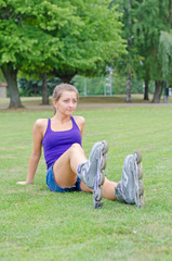 Young woman on roller skates in the park.