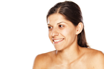 Fototapeta na wymiar portrait of a young smiling woman without make up on a white