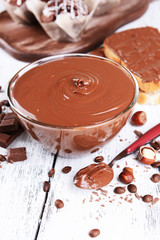 Sweet chocolate cream in bowl on table close-up