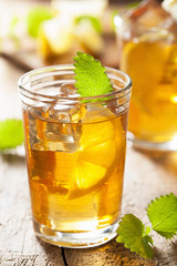 glass of ice tea with lemon and melissa