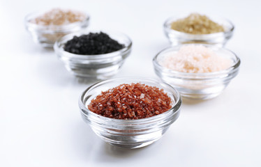Different sea salt in bowls close up