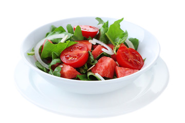 Salad with watermelon, onion, arugula and spinach leaves