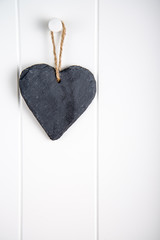 stone hearth shape sign hanging on door