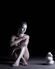 Foto op Aluminium Concept of Zen. Nude woman posing with stone © Wisky