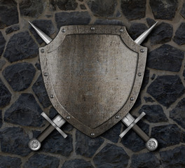 Fototapety  Średniowieczna tarcza i skrzyżowane miecze na kamiennym murze