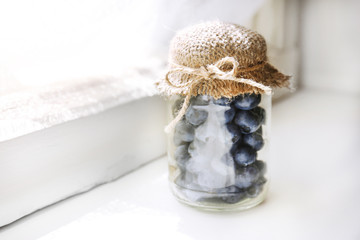 Fresh blueberries on window sill