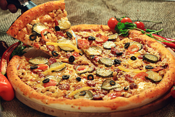 pizza with a slice cut, delicious pastries