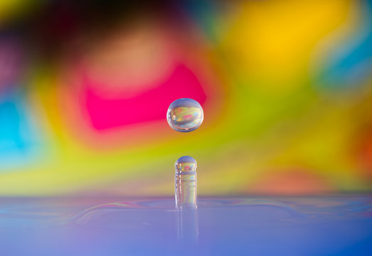 water drop in the air at colorful background