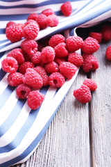 Ripe sweet raspberries on table close-up