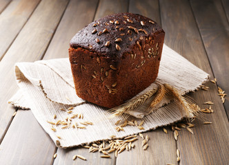 Fresh bread on wooden table, close up