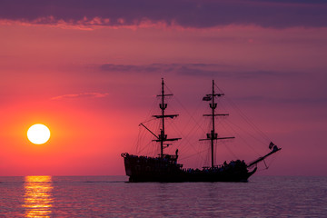 Fototapeta na wymiar Boat on the sea at sunset in Baltic Sea, Poland.
