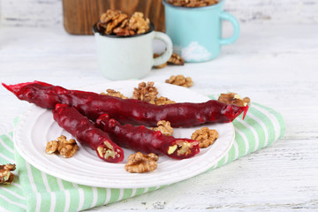 Tasty oriental sweets (churchkhela) and fresh nuts,