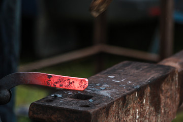 Horse shoe being made by blacksmith