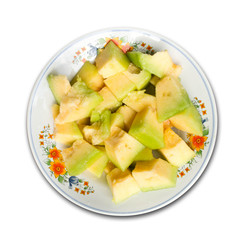 cantaloupe on a plate on white background