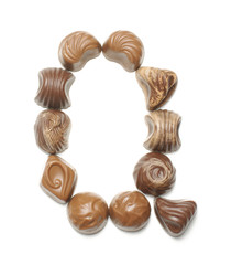 Alphabet letter Q arranged from chocolate sweets isolated