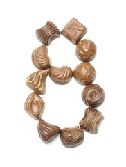 Number 8 arranged from chocolate sweets isolated