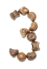 Number 3 arranged from chocolate sweets isolated