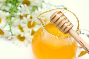 Jar with honey and chamomile
